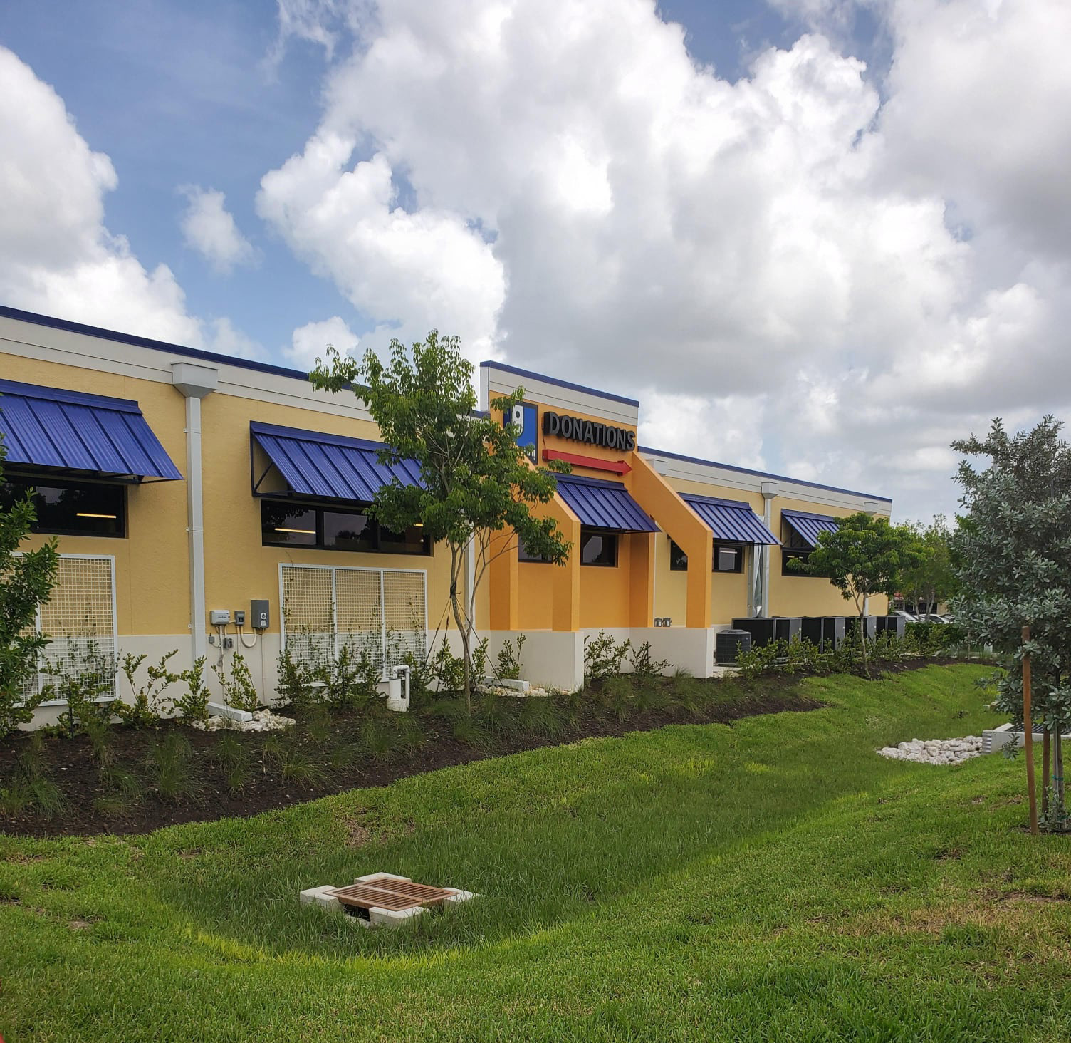 Picture of the side of builduing with Donation Sign